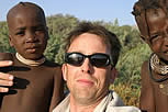 Himba Kids and a vacationtechnician in Serra Cafema Camp Namibia