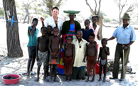 Sharing conversation, laughter and gifts of clothing with a rural  Botswana family between Ghanzi Villages and Maun 2003. -vacationtechnician style